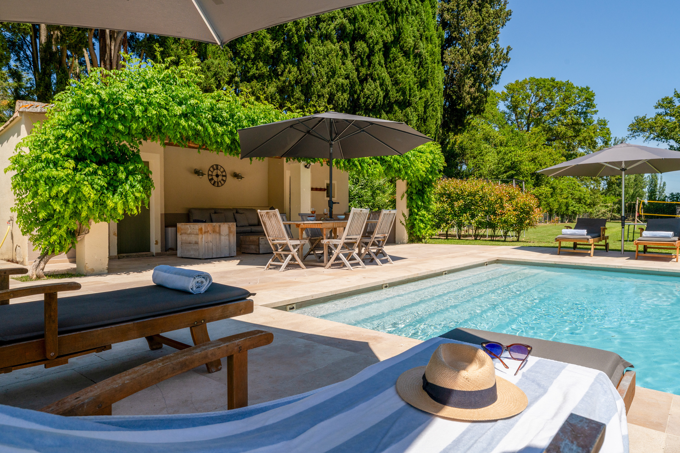 Pool house dining area beside the swimming pool